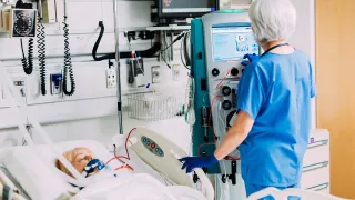 Healthcare professional interacts with the Prismaflex System