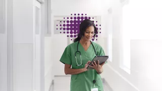 Acute - nurse looking at screen - green shirt 