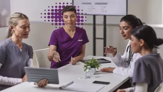 Four nurses in a meeting - purple 