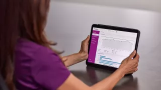 tablet in hands on table