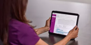 tablet in hands on table